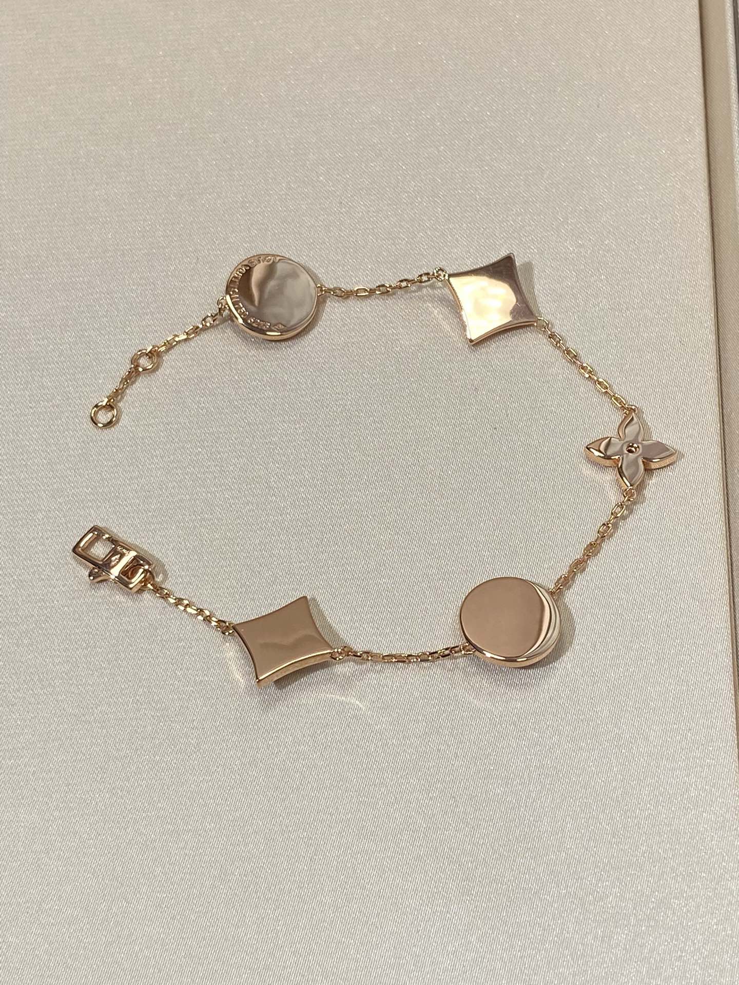 Lumi® Armband mit Stern und Sonne, 5 Motive, rosa-goldenes Armband