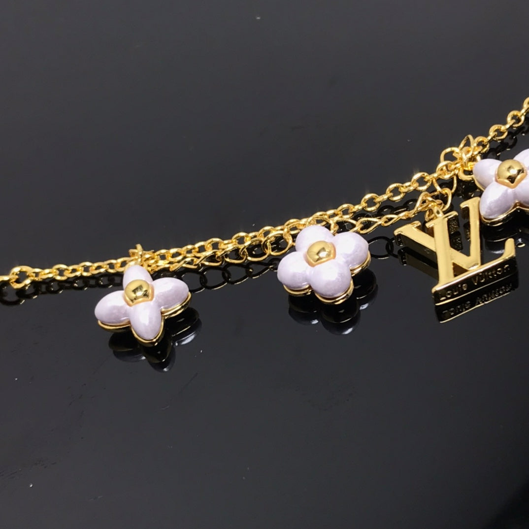 ¡®Lumi¡¯LOGO 6 MOTIF STAR AND SUN GOLD BRACELET