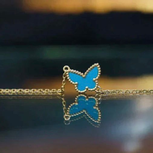 Lumi® Butterfly Türkisfarbenes Schmetterlingsarmband