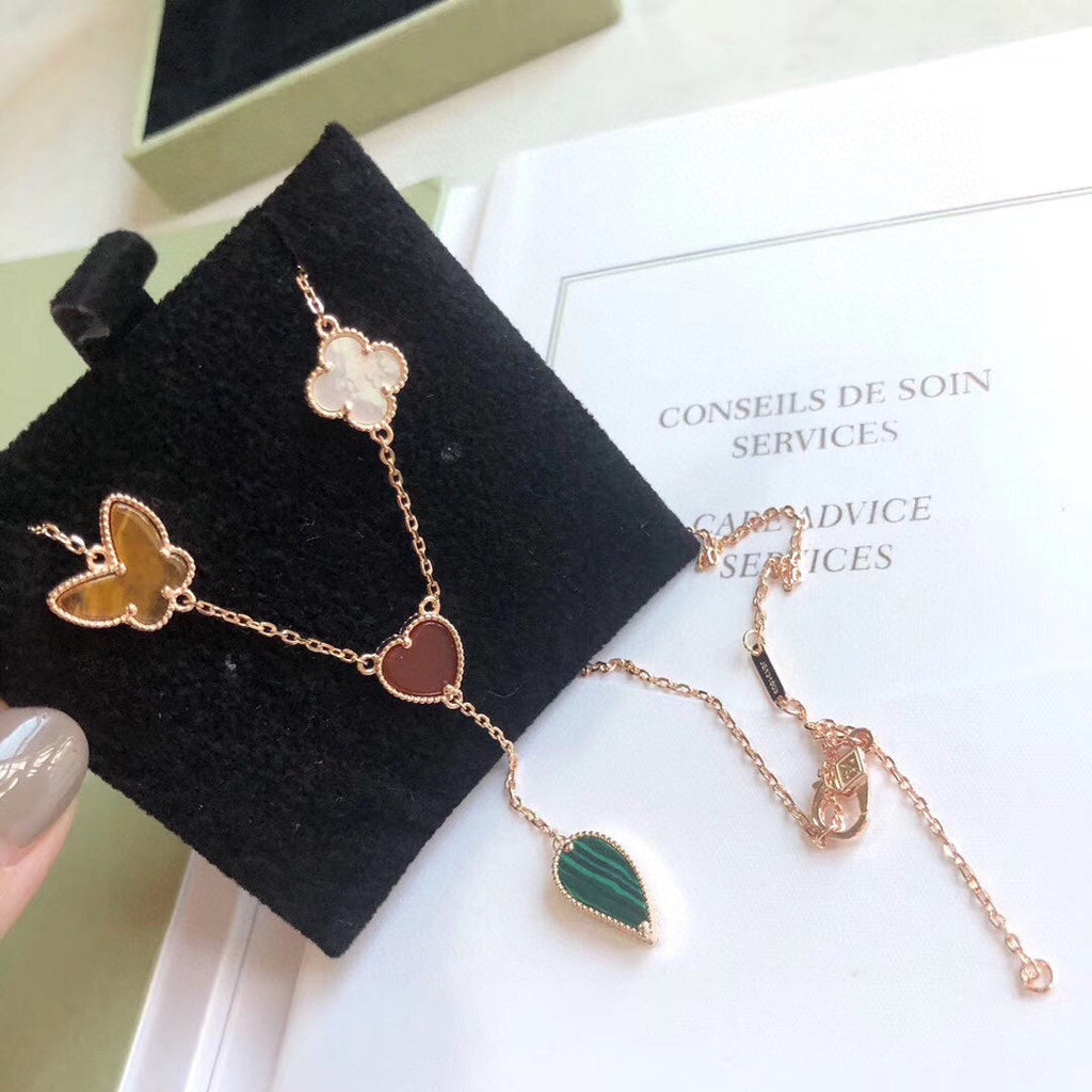 Lumi® Glücksfrühling Halskette mit 4 Motiven in Roségold